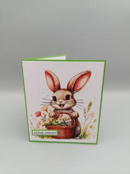 Frohes Ostern Grußkarte — Häschen mit Blumen und grünem Rahmen